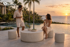 Outdoor concrete furniture in cream-white finish by a resort poolside lounge area Outdoor concrete furniture in cream-white finish by a resort poolside lounge area